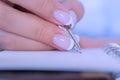 Woman hand holding pen and writing to do list in vintage notebook organizer Royalty Free Stock Photo