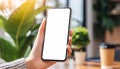 woman hand holding phone with isolated screen in room house Royalty Free Stock Photo