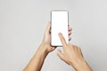 Woman hand holding phone on white background with copy space Royalty Free Stock Photo