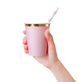 Woman hand holding pink Paper Cup with straws isolated on white background. Template of blank Mug for design.  Clipping path Royalty Free Stock Photo