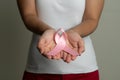 Woman hand holding pink ribbon breast cancer awareness Royalty Free Stock Photo