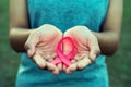 woman hand holding pink ribbon breast cancer awareness Royalty Free Stock Photo