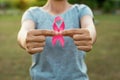 woman hand holding pink ribbon breast cancer awareness Royalty Free Stock Photo