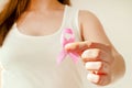 Woman hand holding pink ribbon, breast cancer awareness concept, healthcare and medicine Royalty Free Stock Photo