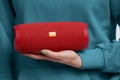 Woman hand holding portable stereo speaker