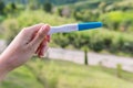 A woman hand holding pregnancy test Royalty Free Stock Photo