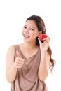 Woman with hand holding red apple, giving thumb up Royalty Free Stock Photo