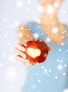 Woman hand holding red apple with heart shape Royalty Free Stock Photo