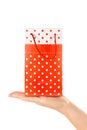 Woman Hand Holding Red Gift Bag with Present Royalty Free Stock Photo