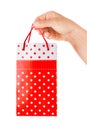 Woman Hand Holding Red Gift Bag with Present Royalty Free Stock Photo