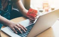 Woman hand holding red gift box about shopping online concept. Royalty Free Stock Photo