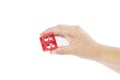 Woman`s hand holding red pencil sharpener Royalty Free Stock Photo