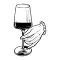 Woman hand holding a red wine glass Royalty Free Stock Photo
