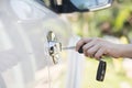 Woman hand holding the remote control to unlock the car door Royalty Free Stock Photo