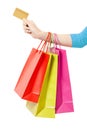 Woman hand holding shopping bags and credit card Royalty Free Stock Photo