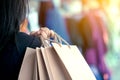 Woman hand holding shopping bags on the street Royalty Free Stock Photo