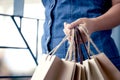 Woman hand holding shopping bags on the street Royalty Free Stock Photo