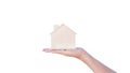 Woman hand holding small home model wooden isolated on white background.Family life and Business real estate concept,Eco house Royalty Free Stock Photo