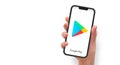 Woman hand holding the smartphone with Google play store app, vector editorial illustration Royalty Free Stock Photo