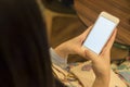 Woman hand holding a smartphone,isolate white on screen