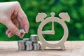 Woman hand holding stack of coins money putting on stack of coin Royalty Free Stock Photo