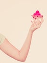 Woman hand holding sweet strawberry cupcake Royalty Free Stock Photo