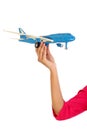 Woman hand holding toy plane Royalty Free Stock Photo