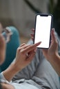 Woman hand holding using touch mobile phone white screen mockup Back view Royalty Free Stock Photo