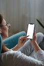 Woman hand holding using touch mobile phone white screen mockup Back view Royalty Free Stock Photo