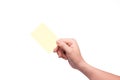 Woman hand holding a yellow notepaper Royalty Free Stock Photo