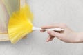 Woman hand holds an economic brush for brushing