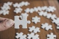 The woman hand holds a jigsaw, solutions and strategy Concep Royalty Free Stock Photo