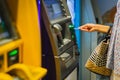 Woman hand insert a credit card into an ATM machine. Royalty Free Stock Photo