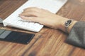 Woman hand keyboard and phone Royalty Free Stock Photo