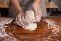Woman Hand Kneaded Fresh Raw Dough on the Wooden Board Royalty Free Stock Photo