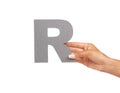 Woman, hand and letter R or alphabet in studio for advertising, learning and teaching presentation. Sign, font and Royalty Free Stock Photo