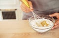 Woman Hand Mixed Batter on Clear Bowl with Baloon Whisk Step by Step Baking Preparation in the Kitchen Royalty Free Stock Photo