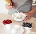 Woman Hand Mixed Batter on Clear Bowl with Baloon Whisk Step by Step Baking Preparation in the Kitchen Royalty Free Stock Photo