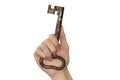 Woman hand with old key on white background Royalty Free Stock Photo