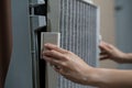 Woman hand open air purifier for clean dirty air purifier HEPA filter Royalty Free Stock Photo