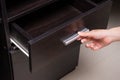Woman hand open drawer Royalty Free Stock Photo
