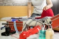 Woman hand packing a luggage for a new journey and travel for a long weekend Royalty Free Stock Photo