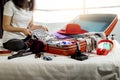 Woman hand packing a luggage for a new journey and travel for a Royalty Free Stock Photo