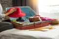 Woman hand packing a luggage for a new journey and travel for a Royalty Free Stock Photo