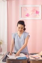 Woman hand packing a luggage for a new journey and travel for a long weekend Royalty Free Stock Photo