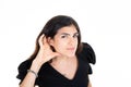 Woman hand palm in earphone earpiece because she does not hear in concept of deaf