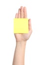 Woman hand palm holding a yellow notepaper