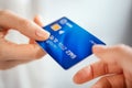 Woman hand passing credit card Royalty Free Stock Photo