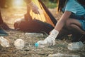 woman hand picking up garbage plastic bottle for cleaning Royalty Free Stock Photo