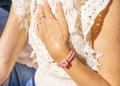 Woman hand with pink bracelet. Women& x27;s jewelry. Beautiful rose tones bracelet.